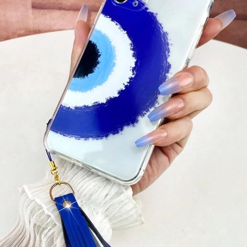 Transparent cell phone case with evil eye pattern with fringe